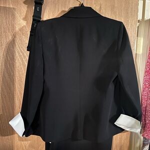 Kasper Classics black suit with pencil skirt, white cuffs and collar, size 6